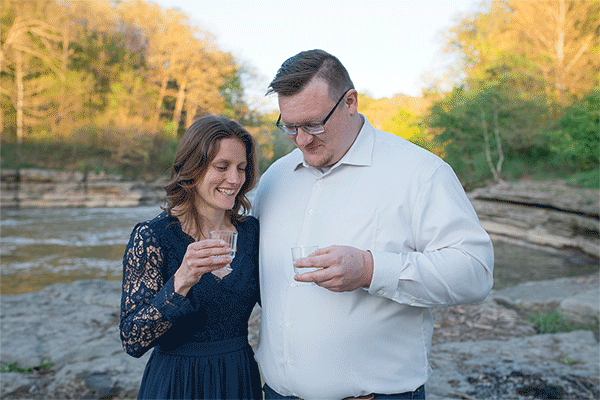 GIF of couple toasting with champagne after proposal.