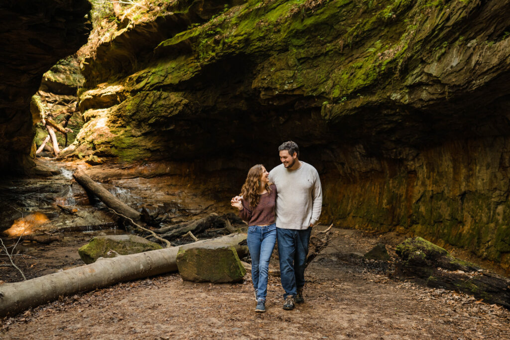 Couple walking together in a rocky gorge.