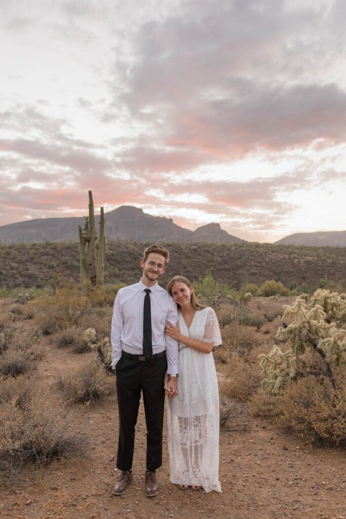 Bride and groom smile at the end of their Arizona elopement.