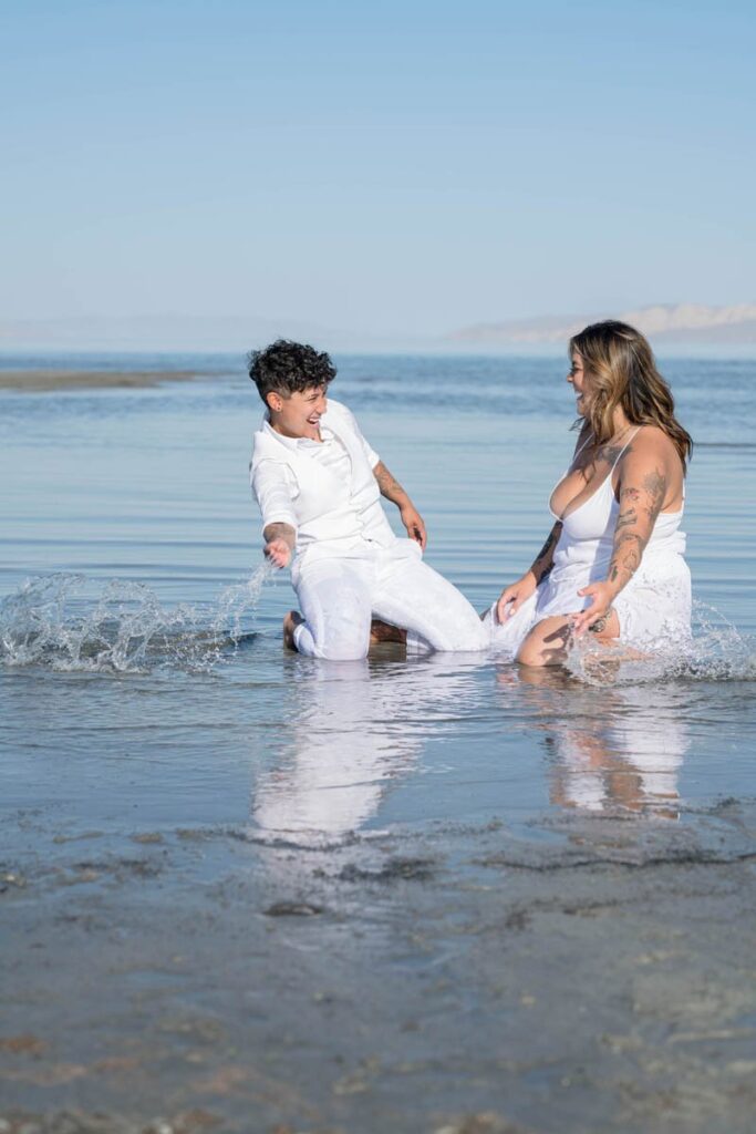 Brides playing in the water at the Great Salt Lake in Utah.