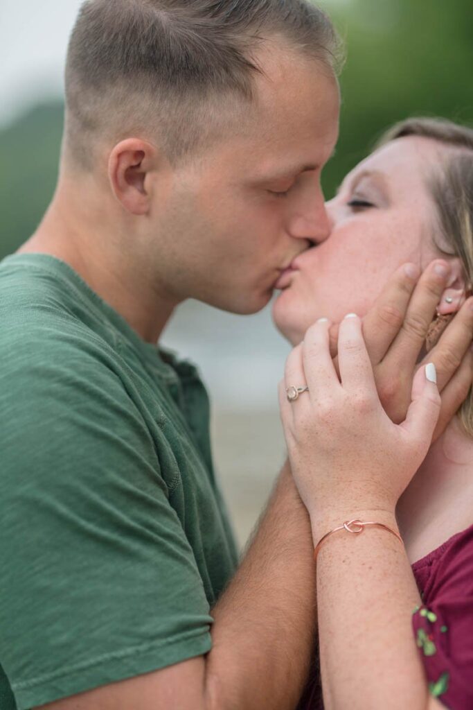 Couple kisses overlooking Cataract Falls.