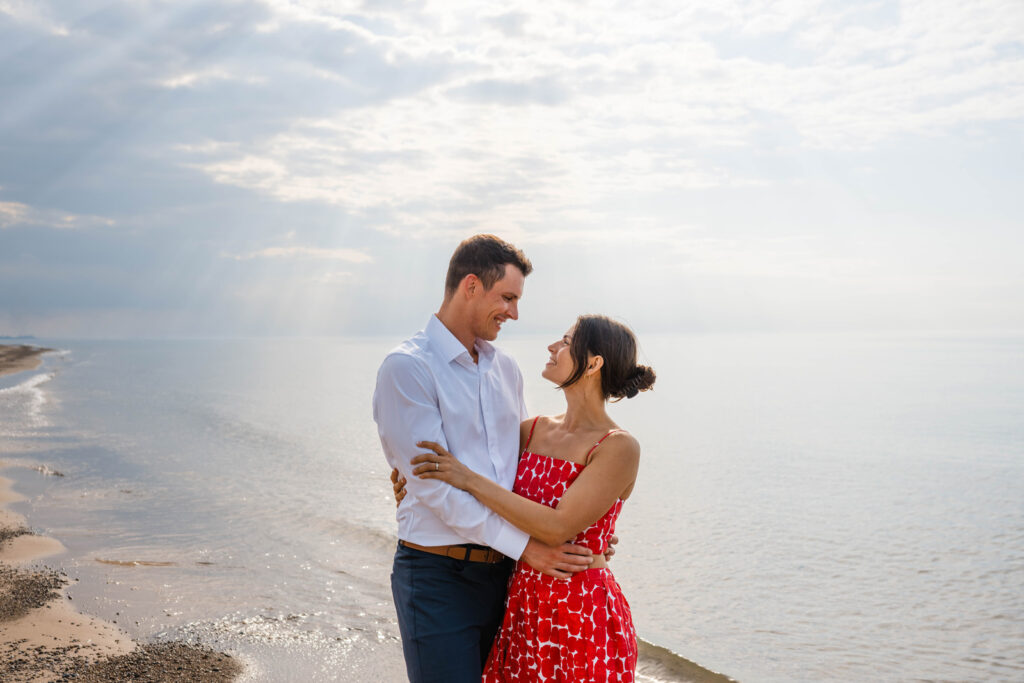 Couple gets engaged and has beach engagement photos taken at Indiana Dunes National Park.