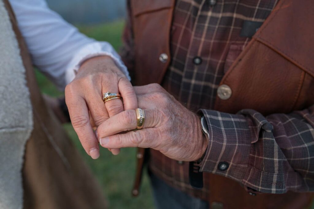 Married couples should show off their beautiful wedding rings during couples photography sessions.