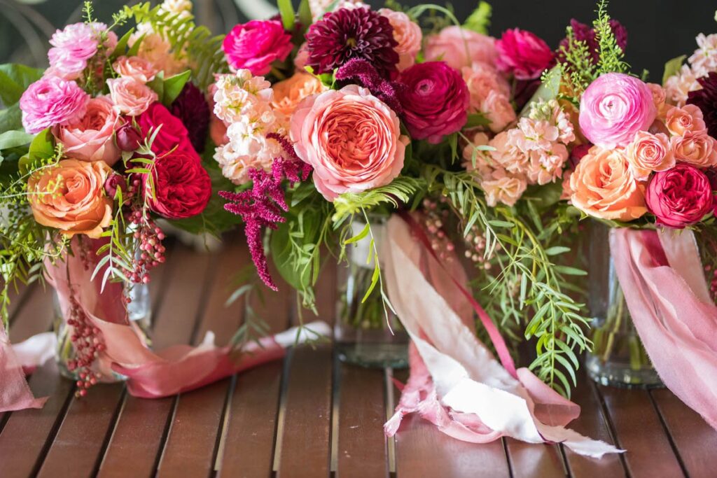 Bride and bridesmaids colorful bouquets at Kennedy Estate wedding.