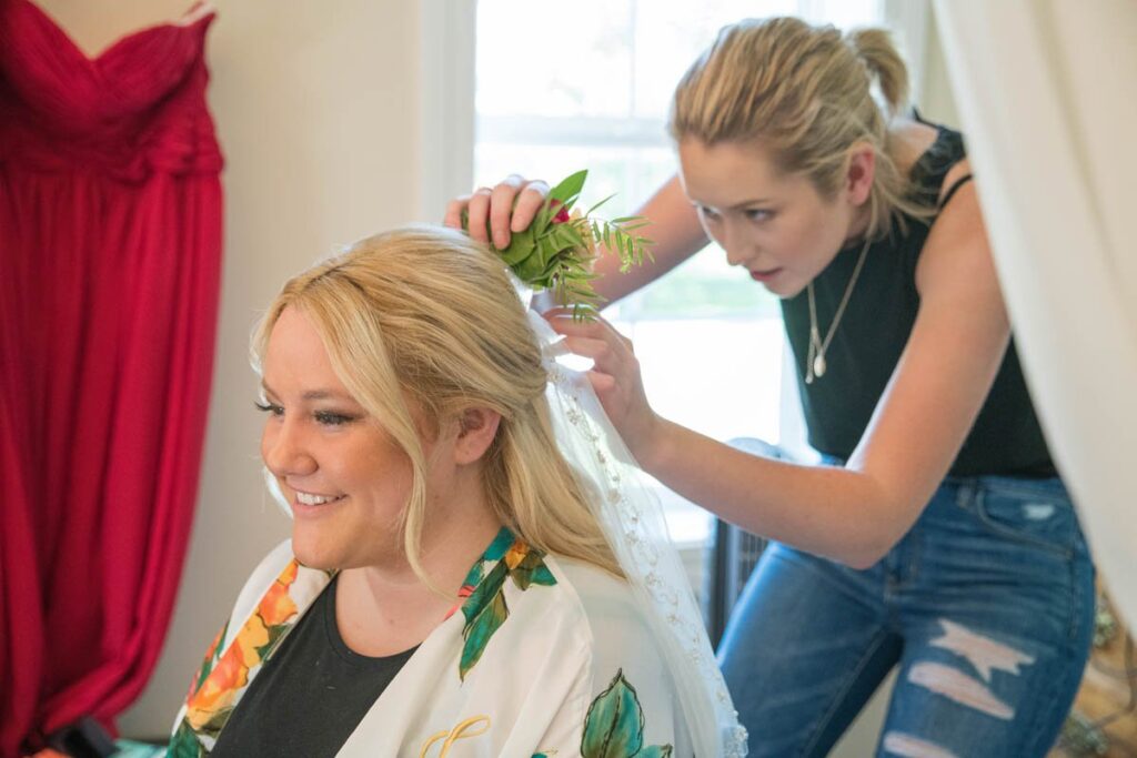 Bride getting hair done at Kennedy Estate wedding.