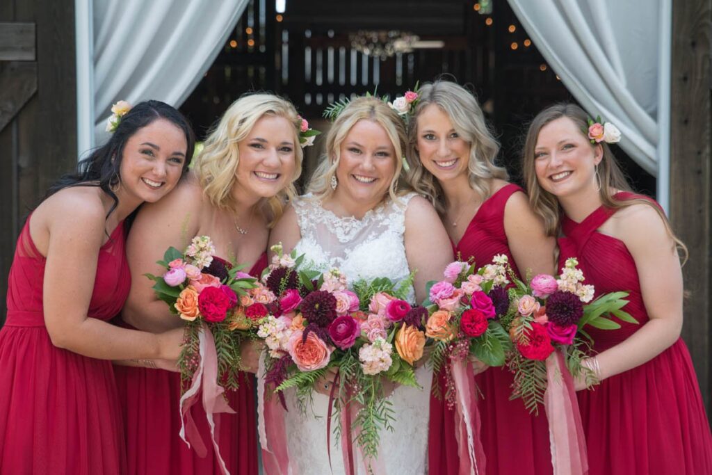 Bride and bridesmaids with bouquets at Kennedy Estate.