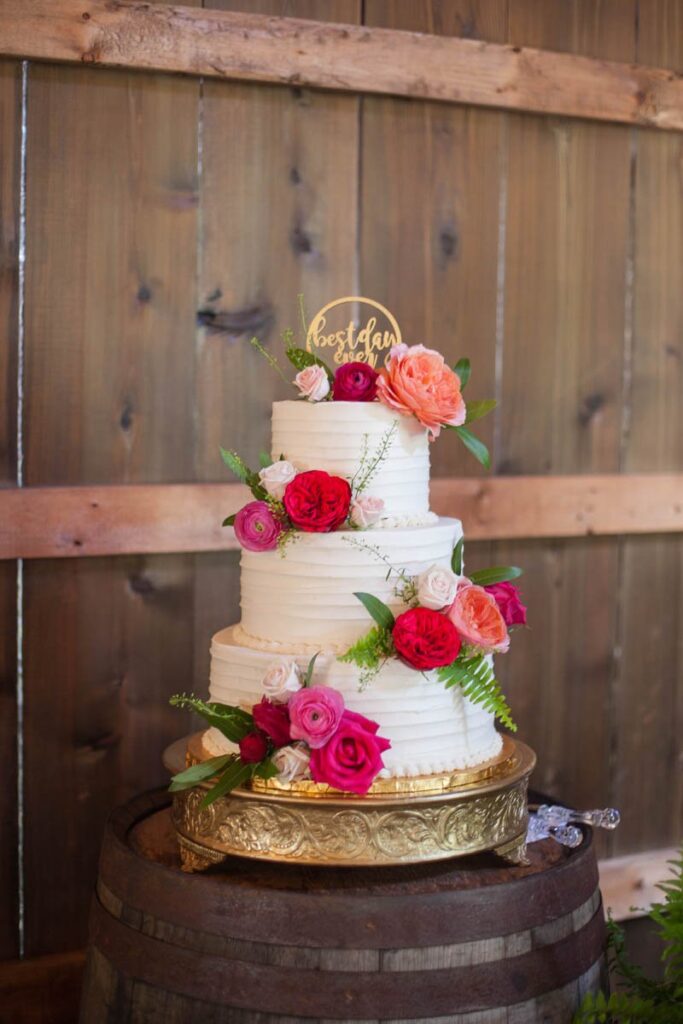 Cake decorated with flowers at Kennedy Estate wedding