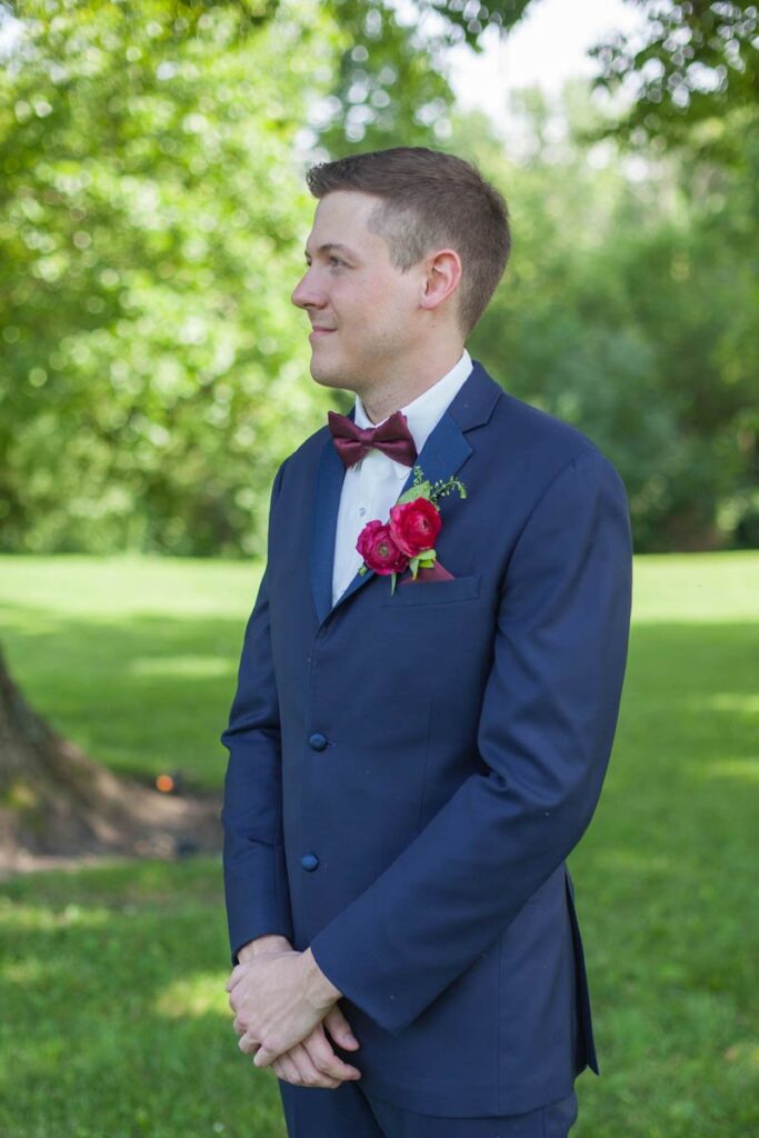 Groom portrait with boutonniere at Kennedy Estate wedding.