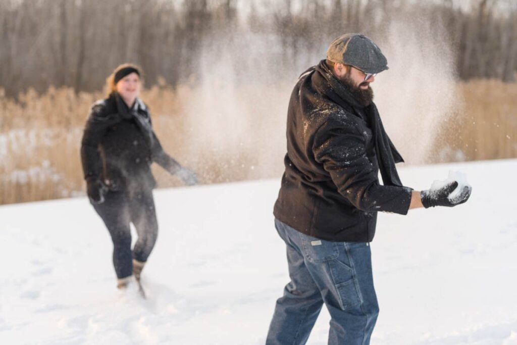 Photoshoot in the snow ends with a snowball fight.