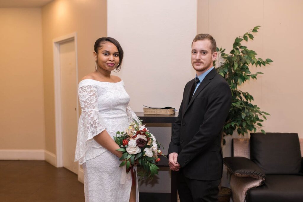 Bride and groom pose for a serious portrait before their Indianapolis elopement starts.