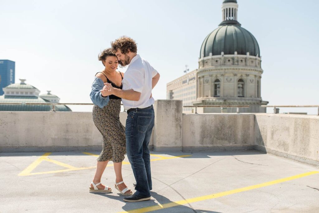Couple dances in front of the Indianapolis Capital Building.