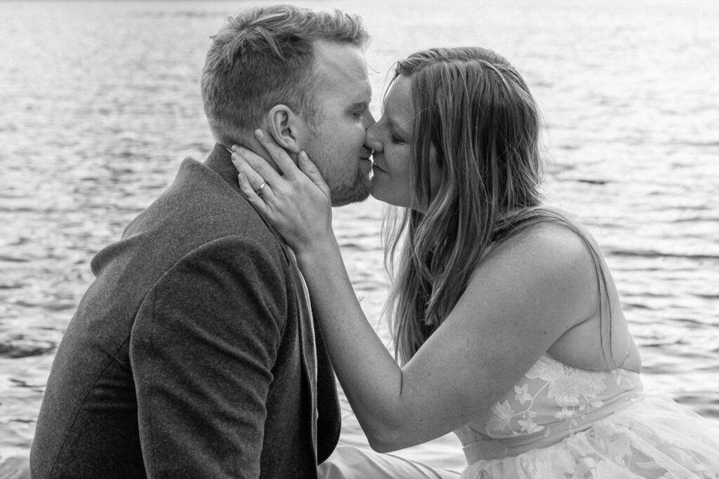 Black and white image of a couple before they kiss.