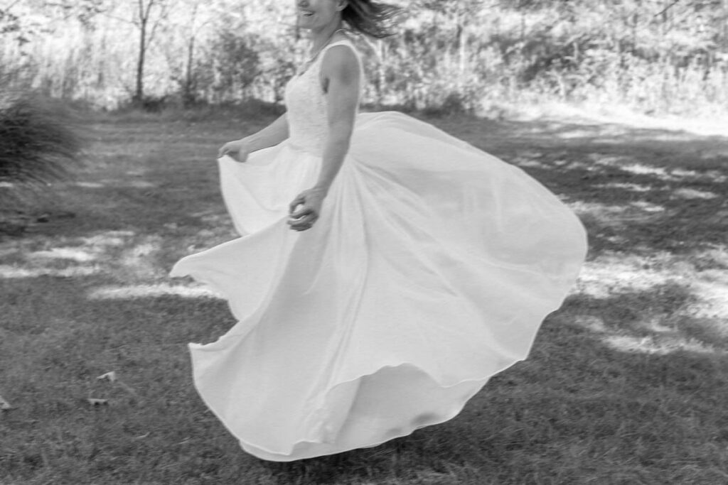 Bride twirls in her dress.