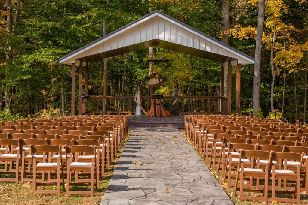 Outdoor wedding ceremony space at Owl Ridge in autumn.