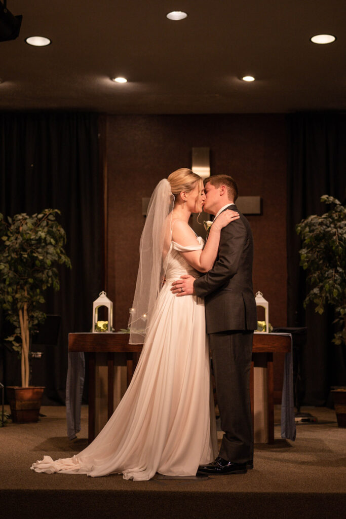 Newly married couple shares their first kiss at their church ceremony at Cornerstone Christian Church in Brownsburg, Indiana.