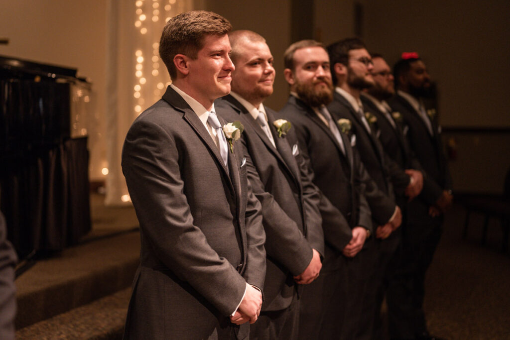 Groom crying when he sees bride walking down the aisle for the first time.