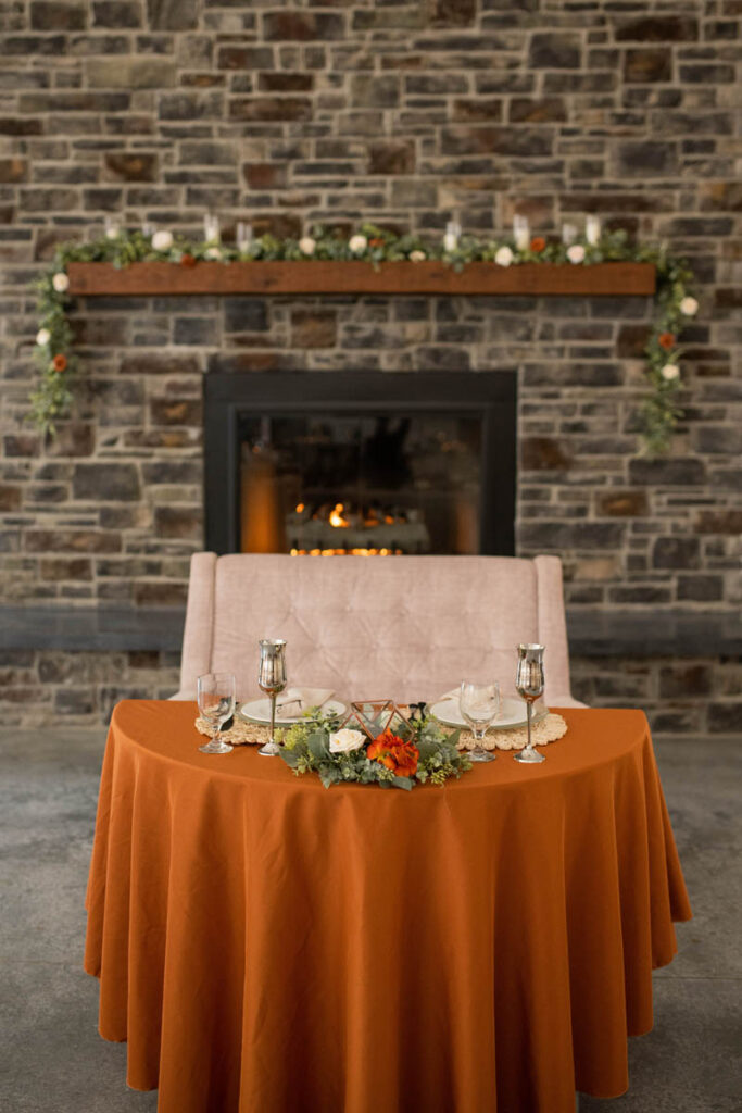 Sweethearts table decorated in rented items with fall colors.