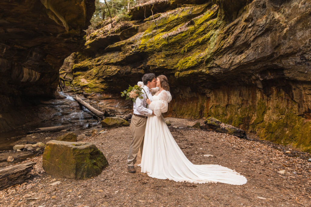 Bride and groom share their first kiss while they elope in Turkey Run State Park.