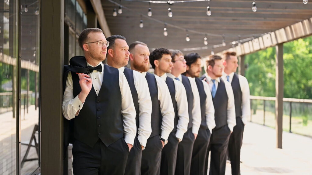 Groom stands with groomsmen at The Conservatory at Evergreen, one of the most beautiful outdoor wedding venues in Indianapolis.