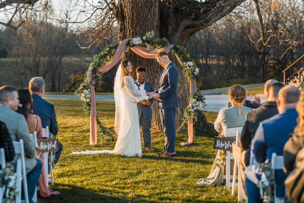 Bride and groom exchange their vows outside at Ash & Oak Weddings, an outdoor wedding venue in Indianapolis.