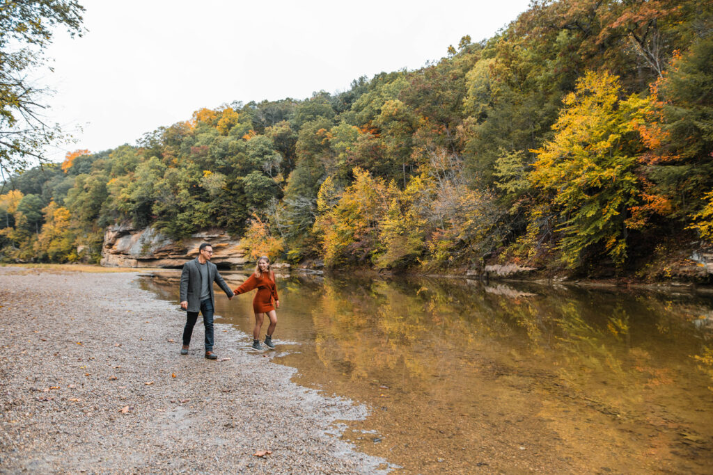 Turkey Run State Park is one of many outdoor engagement location ideas in Indiana where couples can play in creek water and walk along the shore.