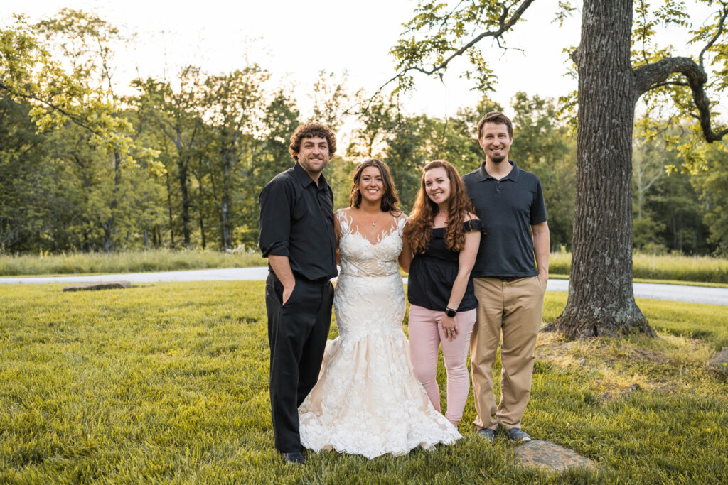 Photographers standing with bride and groom on their wedding day