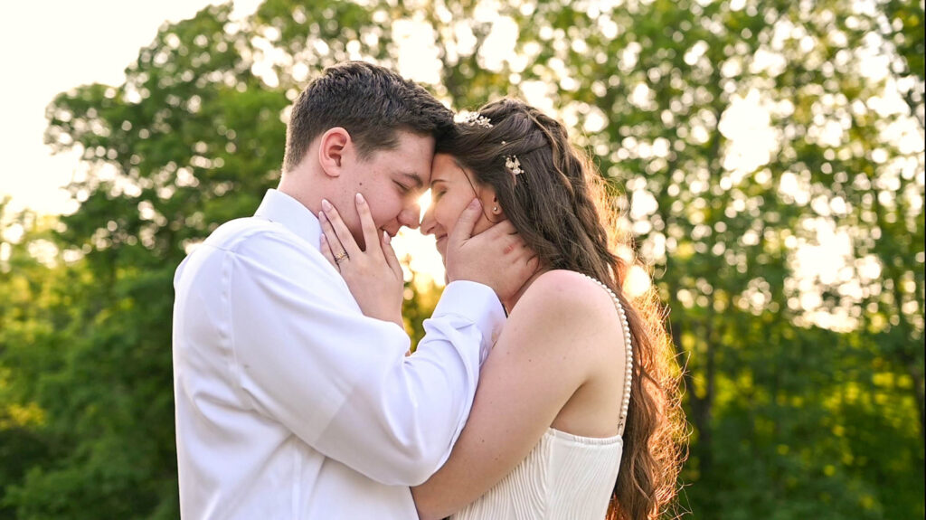 Couple rests faces together as the sun sets behind them during their wedding at The Wilds Wedding Venue.