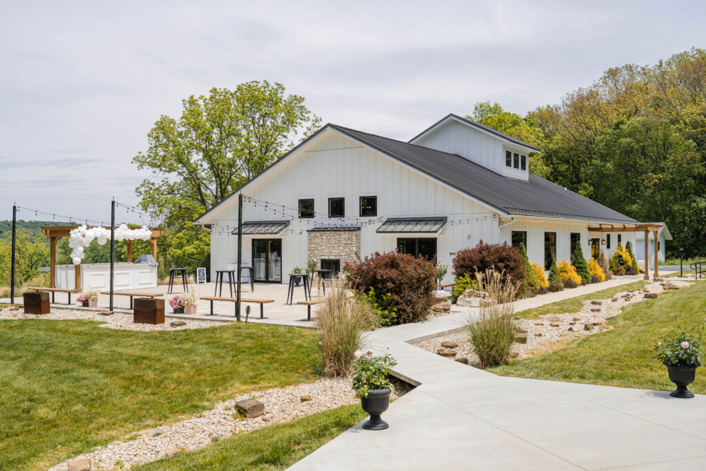 The Wilds Wedding Venue has an open air patio with string lights and a bar.