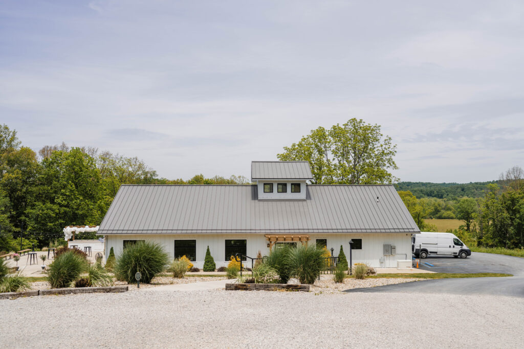 The Wilds Wedding Venue consists of a large white reception building.