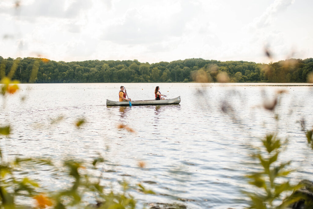 Couple rows a canoe in Eagle Creek Reservoir. 