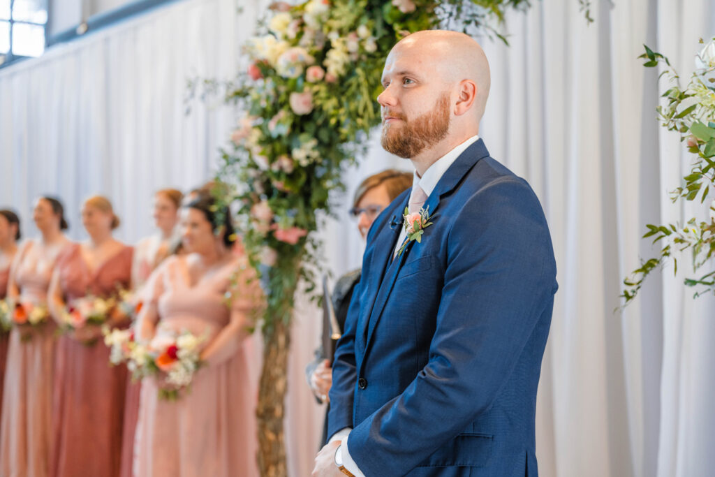 Groom waiting for bride to walk down the aisle.
