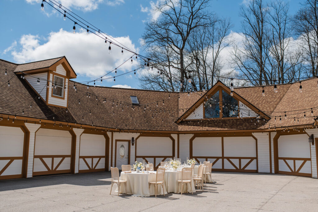 Outdoor reception space under twinkle lights.