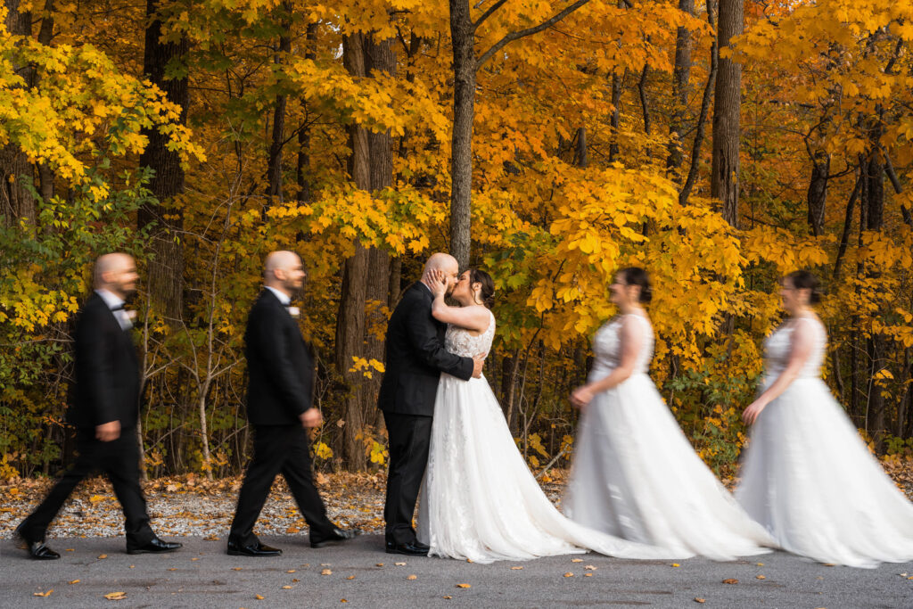 Bride and groom in a triple exposure photograph walking towards one another for a kiss in front of yellow trees at The Bluffs at Conner Prairie wedding venue.