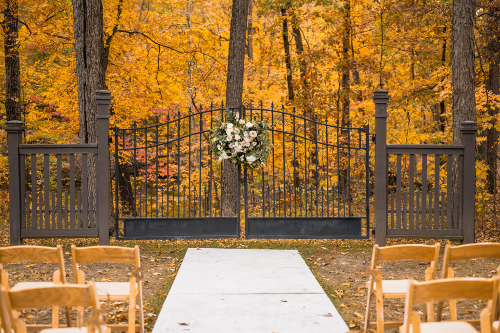 Gate at The Bluffs at Conner Prairie wedding venue covered with florals.
