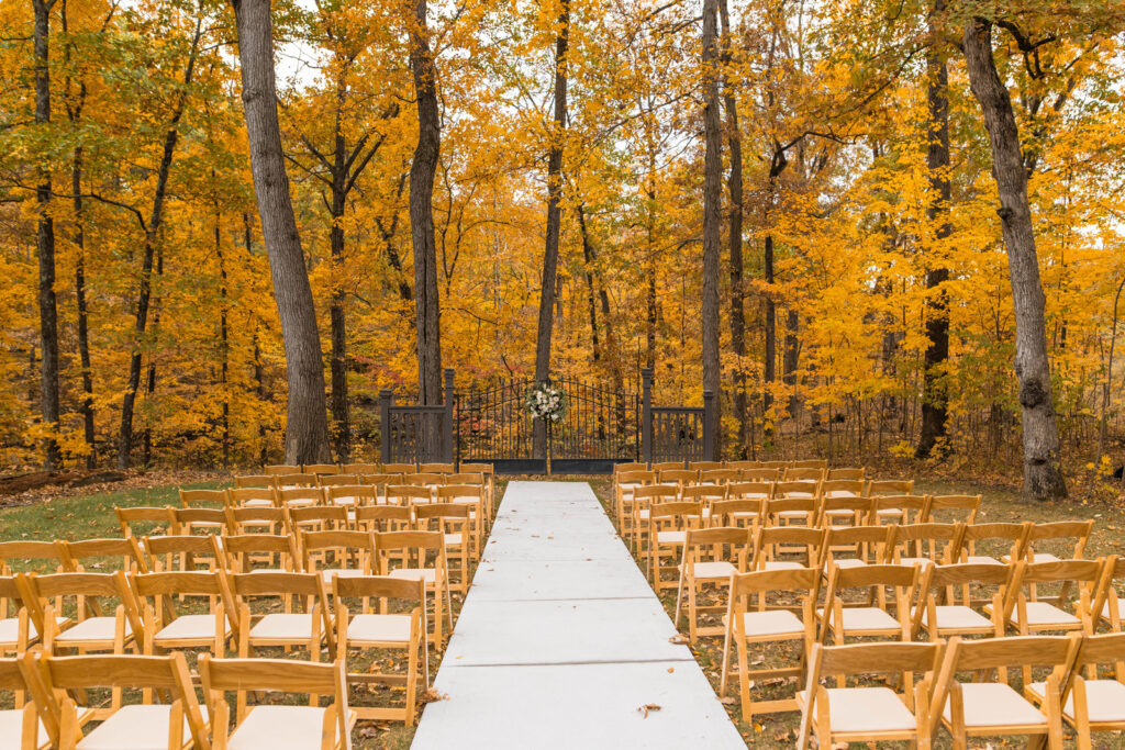An outdoor forest ceremony can take place at The Bluffs at Conner Prairie wedding venue.