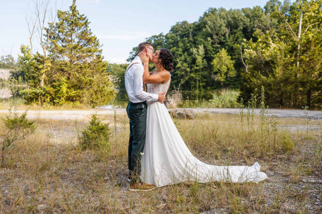 Bride and groom share first kiss.