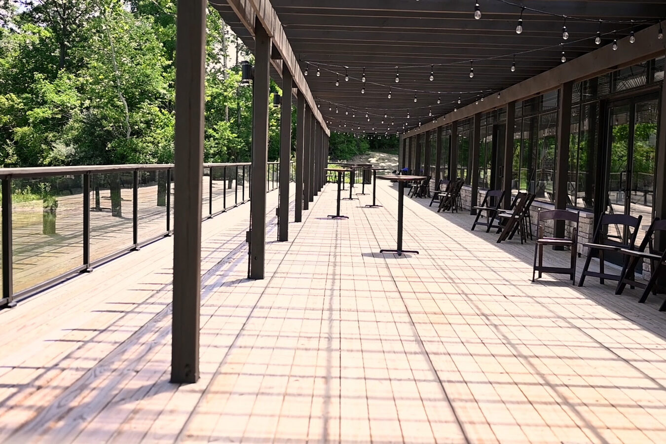 Covered pergola that looks over lake.